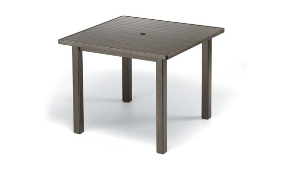 A simple square outdoor table with a slatted top and a stove insert in the center, set on four sturdy legs, shown against a plain white background.