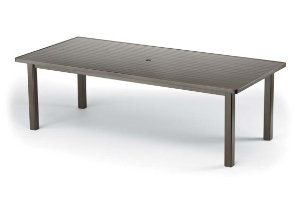 A modern rectangular outdoor table with a ribbed surface and sleek metal legs, featuring an integrated fire pit, presented against a plain white background.