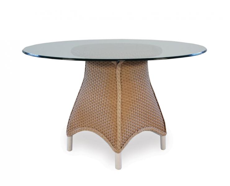 A modern coffee table with a translucent glass top and a tan, woven base featuring a unique, curved design on a white background with an insert fireplace.