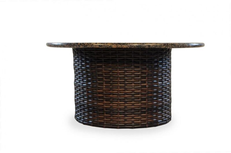 A round wicker coffee table with a polished, mottled brown stone top resembling a fireplace, isolated on a white background.