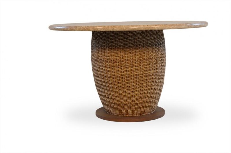 A wicker dining table with a circular, polished wooden top and a textured woven base featuring a fire pit insert, isolated on a white background.