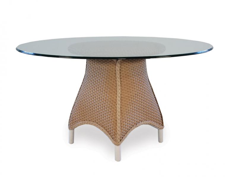 Round glass tabletop on a woven base with white legs, isolated on a white background with a fireplace insert.