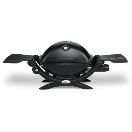 Portable black Weber Q-1200 gas grill with a rounded lid and thermometer, featuring foldable side shelves and a sturdy base, isolated on a white background.