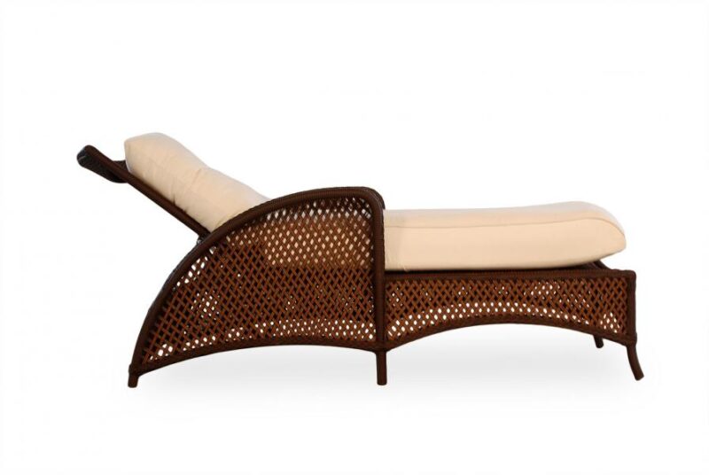 An elegant chaise lounge with a dark brown wicker base and a light-beige cushion, isolated near a fire pit on a white background.