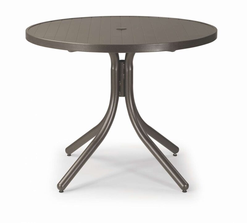 A round, gray plastic outdoor table with a four-legged metal base and a stove insert, isolated on a white background.