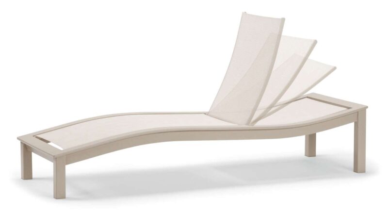 A modern, beige poolside lounger with an adjustable backrest, set against a white background and accented by a sleek fireplace.