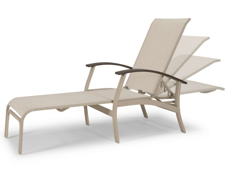 A light beige adjustable outdoor lounge chair with a fabric sling seat and backrest, set against a fire pit.