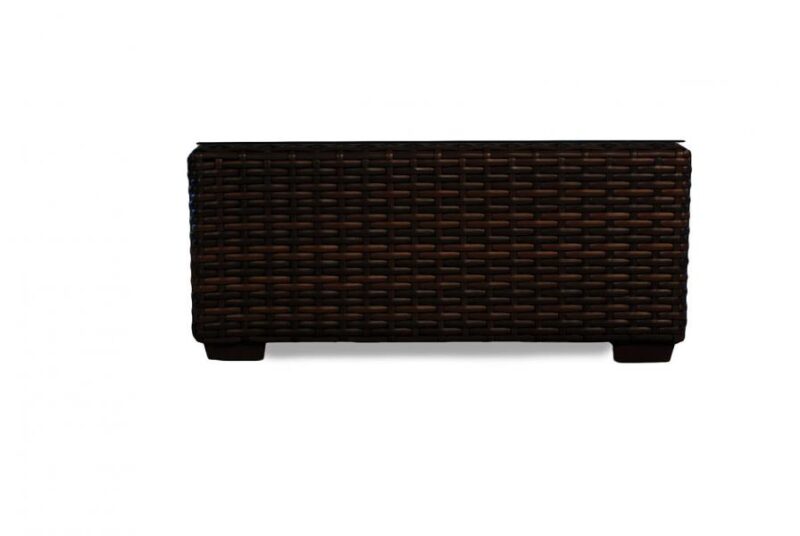 A dark brown wicker storage chest isolated on a white background, perfect for use beside a fireplace.