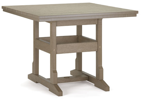 A sturdy, beige drafting table with a textured top and lower storage shelves, supported by thick legs. The table is positioned against a plain white background, insert ideal for designers and architects.