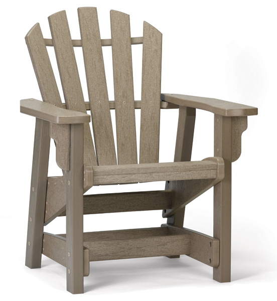 A classic adirondack chair made of weathered gray composite materials, shown in a fire pit background setting. The chair features wide slats and a comfortable, angled backrest.