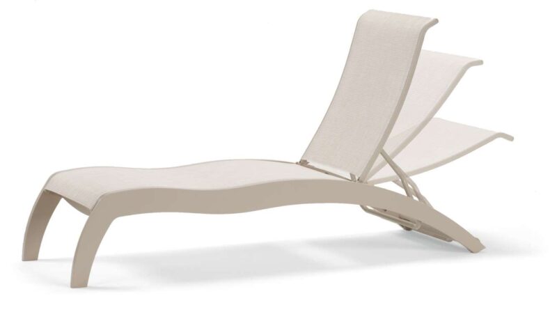 A modern beige lounge chair with a curved design and an adjustable backrest, set against a plain white background near a fireplace.
