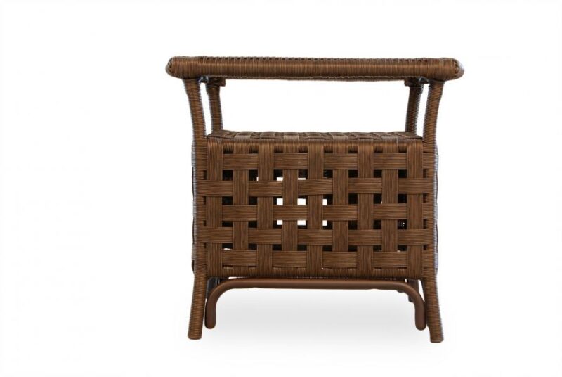A wicker nightstand with an intricate weave pattern and a raised top edge, isolated on a white background.