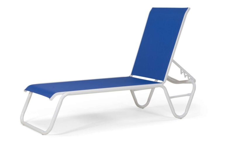A modern blue and white outdoor chaise lounge chair with a nearby fire pit, isolated on a white background.