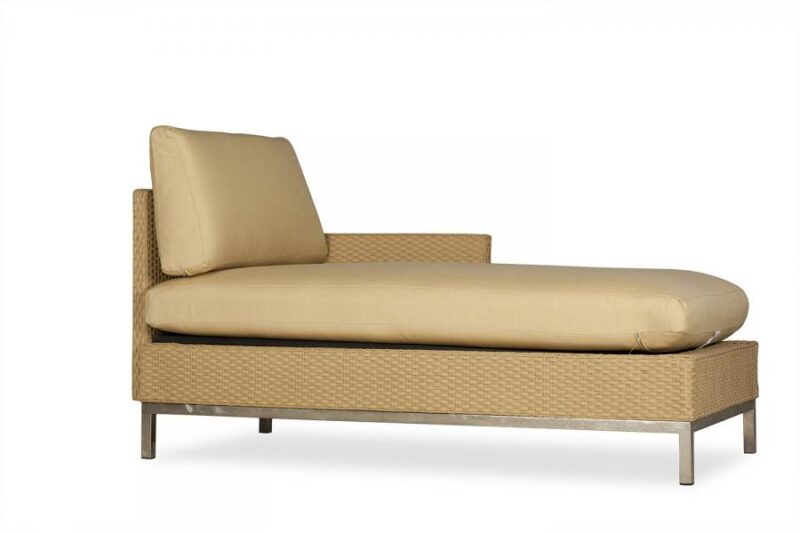 A modern beige chaise lounge with a woven frame and plush cushioning, featuring a fire pit insert, isolated on a white background.