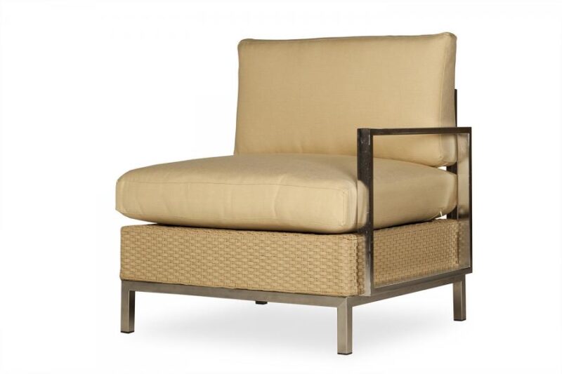 A modern chaise lounge with beige cushions, featuring a rattan base and a sleek black frame, isolated on a white background, includes an insert fireplace.