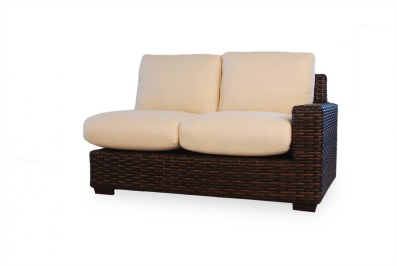 Two-seat wicker sofa with cream cushions and a fire pit insert on a white background.