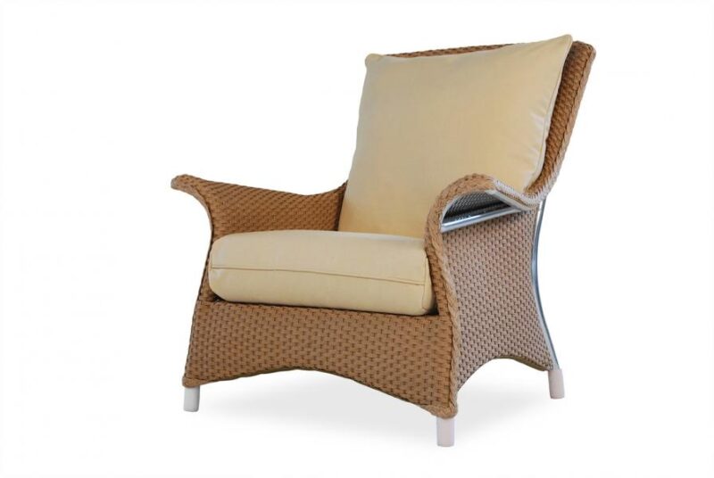 A modern wicker armchair with plush beige cushions and a small pillow, insert against a white background.