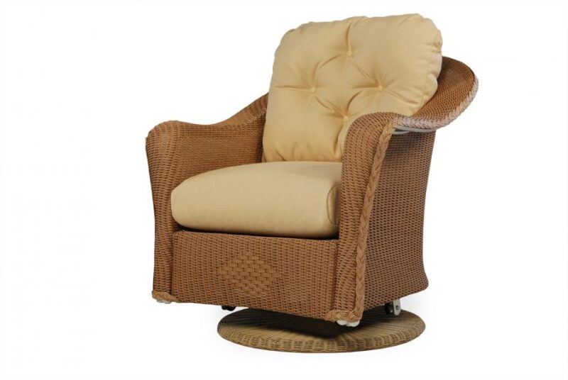 A plush, tufted back swivel recliner chair in woven rattan with a soft cushioned seat and a stove insert, isolated on a white background.