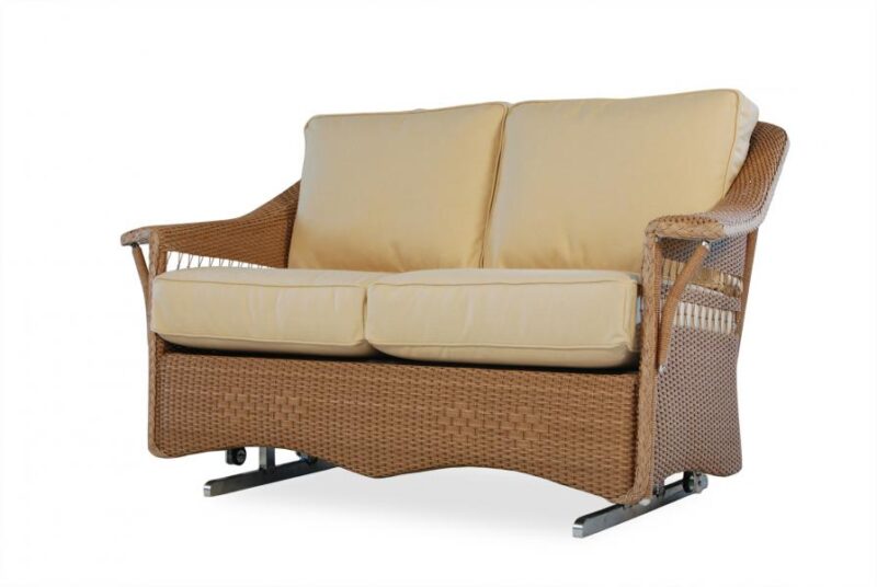 A modern two-seater sofa with a brown wicker frame and beige cushions, featuring an integrated fire pit, isolated on a white background.