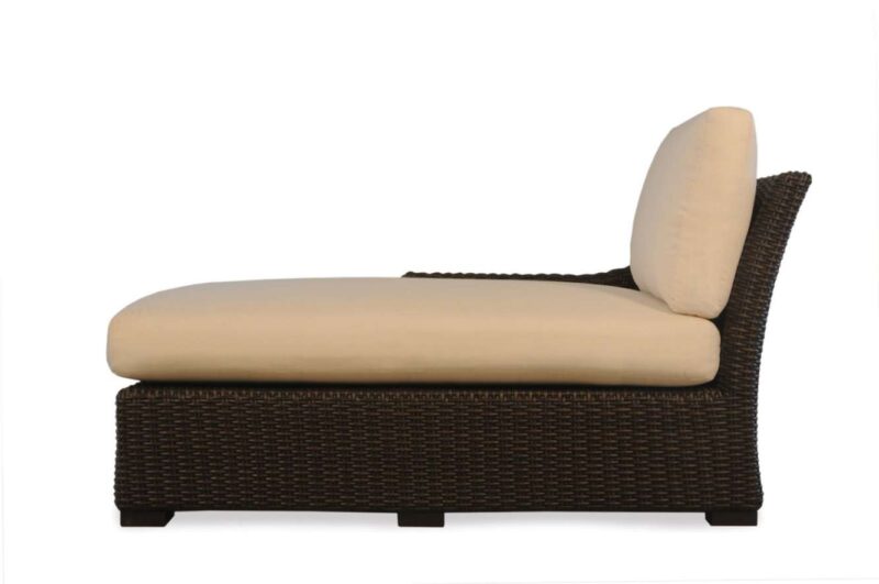 A side view of a modern outdoor chaise lounge with a dark brown wicker base and a light beige cushion, isolated on a white background, featuring an insert for a fire pit.