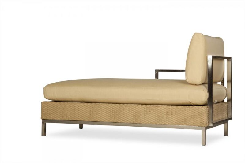 A modern single daybed with a beige mattress and a woven base featuring a side table and a fireplace insert integrated into the headrest, set against a white background.