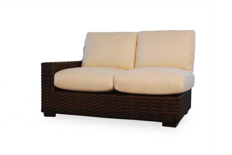 A two-seater sofa with a dark brown wicker frame and cream cushions, featuring a built-in fire pit, isolated on a white background.
