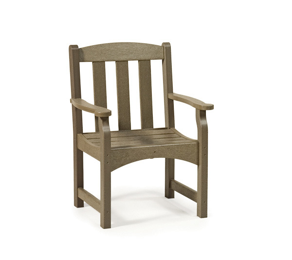 A simple, sturdy gray chair with a high back and armrests, isolated on a white background near a fireplace.