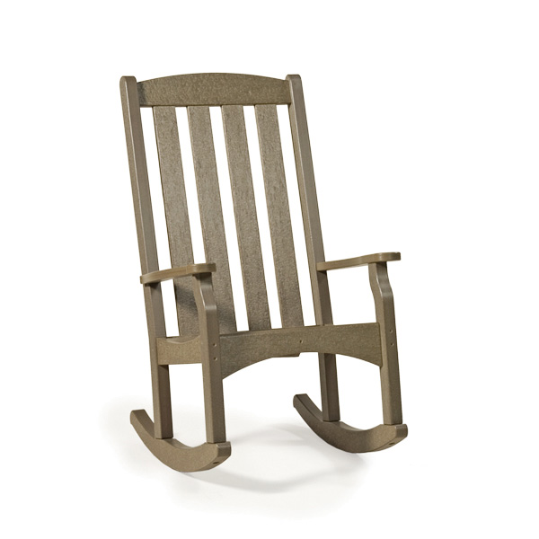 A classic brown wooden rocking chair isolated on a white background, featuring a tall slatted back and sturdy armrests, positioned near a fireplace.