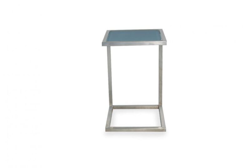 A modern, minimalist side table with a square blue glass top and a sleek, silver metal frame designed to complement a fireplace, isolated on a white background.