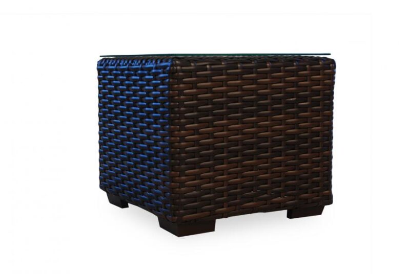 A square wicker basket in brown with a gradual fade to blue at the top, isolated on a white background, perfect as a stylish fireplace insert.