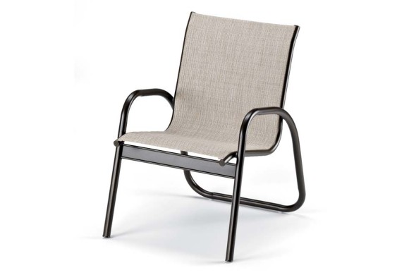 A modern chair with a sleek black metal frame and a light beige fabric seat and backrest, isolated on a white background with a fireplace insert.