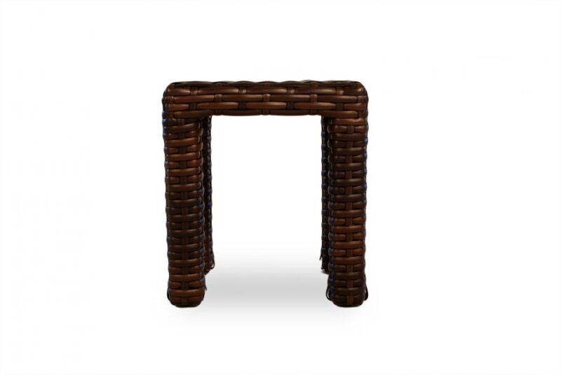 A brown wicker stool with a simple, open-frame structure, isolated on a white background.