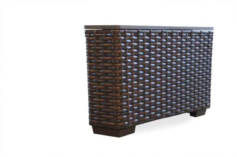 A woven wooden cabinet with a dark finish, featuring an intricate pattern and a solid base, isolated near a fireplace on a white background.