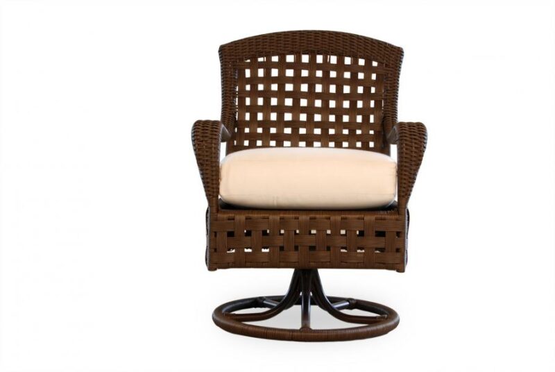 A modern swivel chair with a brown wicker frame and a comfy beige cushion, set against a plain white background, insert near a cozy fire pit.