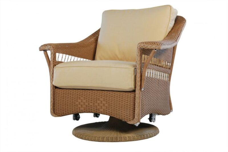 A swivel rattan armchair with a beige cushioned seat and backrest, ideal for cozy evenings by the fire pit, isolated on a white background.