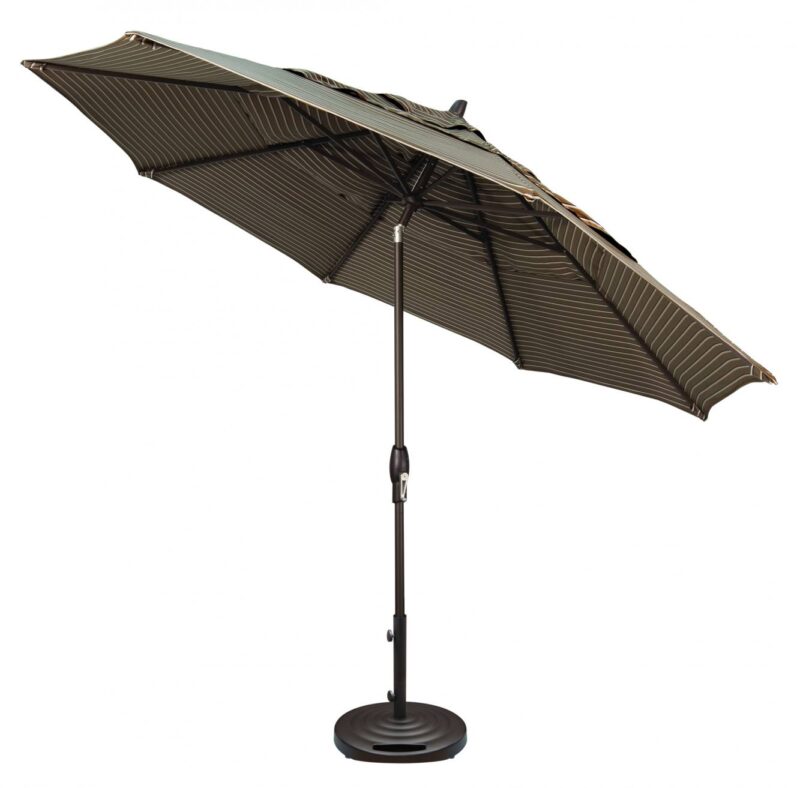 A large outdoor umbrella with a striped canopy in shades of tan and black, supported by a black metal pole and base, isolated on a white background, next to a pizza oven.