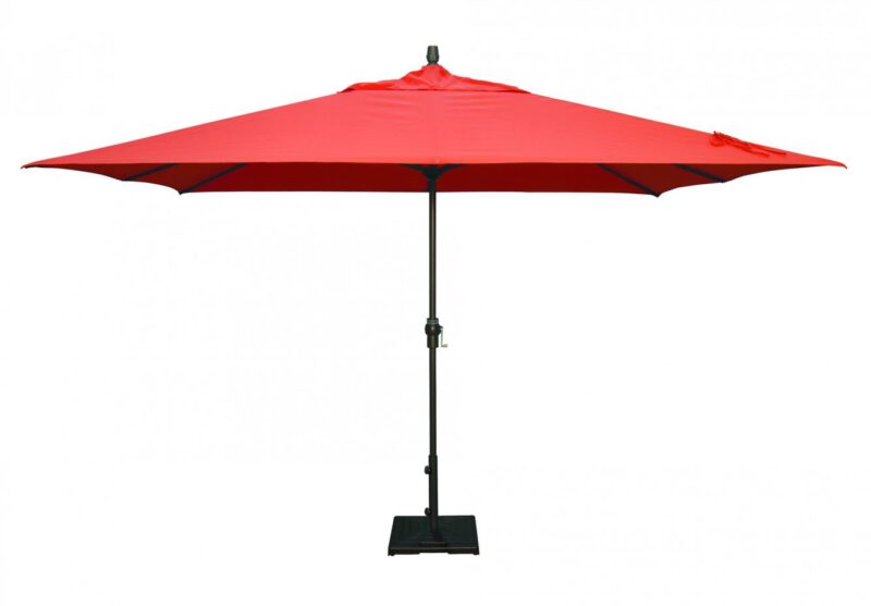 A large red patio umbrella on a black metal stand, fully opened against a plain white background, next to a black grill.