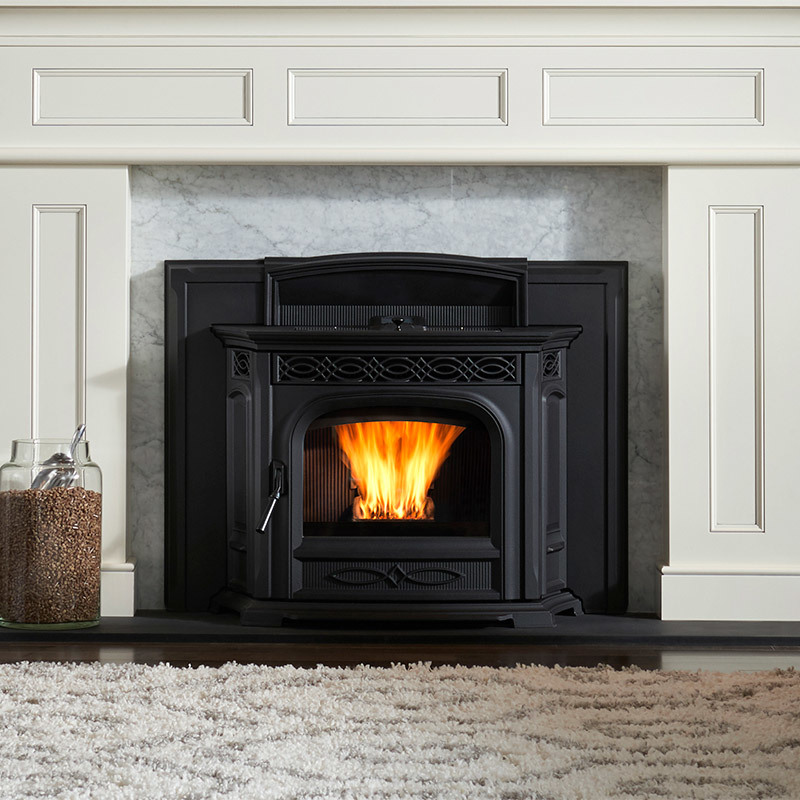 Accentra 52i pellet insert by Harman in matte black finish with marble surround and white contemporary woodwork