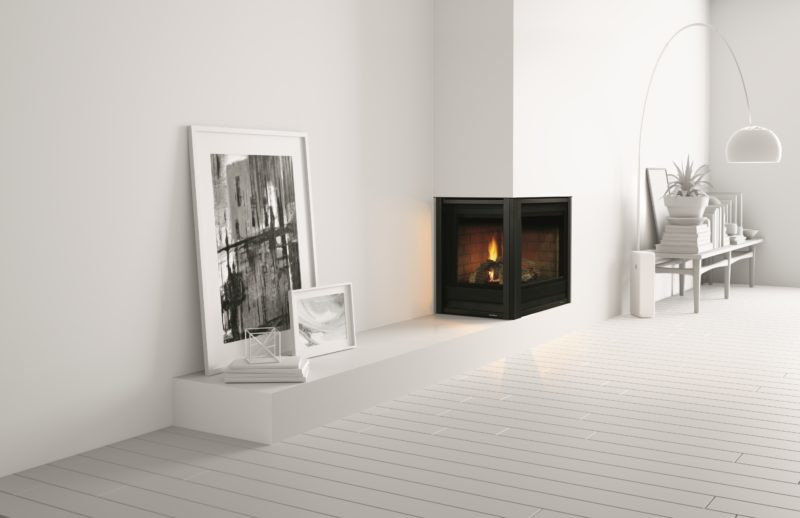 Corner Series modern gas fireplace by Heat & Glo in black against a white corner wall in a living room