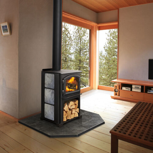 Discovery II wood stove by Quadra-Fire with custom personalized side panel against a tan wall of living room