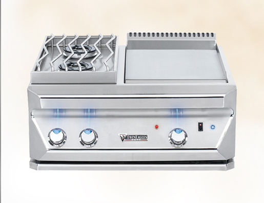 A commercial stainless steel gas stove with four burners, featuring blue control knobs and a flat griddle section to the right, set against a light gray background.