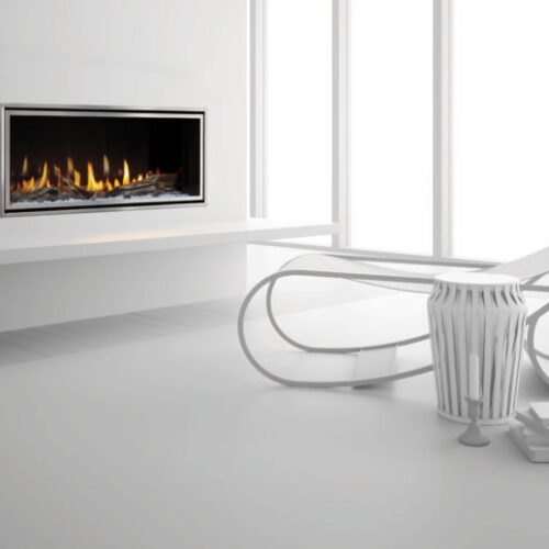 Mezzo 36-inch see-through gas fireplace by Heat & Glo with Loft Forge front against a modern white hearth