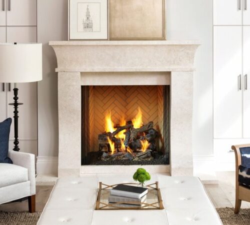 Rutherford wood fireplace by Heat & Glo in Black with Bi-Fold Glass doors with a tan surround in a living room