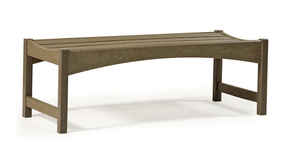 A curved, minimalist concrete bench with a smooth, horizontal seating surface and sturdy rectangular legs, isolated on a white background near a fireplace.