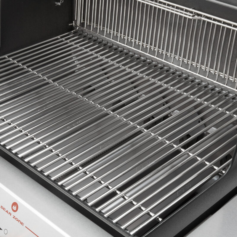 Close-up view of a shiny, stainless steel grill rack inside a modern Weber Genesis S-435 four-burner natural gas grill, showcasing its clean and unused metal bars.