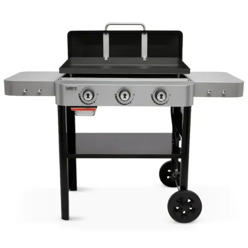 A weber three-burner propane gas grill with a closed lid, featuring side tables and wheels for mobility, isolated against a white background.